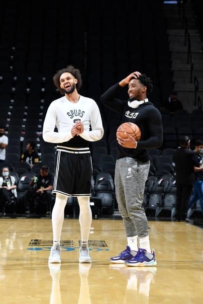 Derrick White of the San Antonio Spurs and Donovan Mitchell of the Utah Jazz talk before a pre-season game on October 4, 2021 at the AT&T Center in...