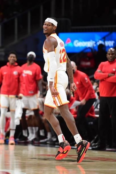 Cam Reddish of the Atlanta Hawks celebrates during a preseason game against the Cleveland Cavaliers on October 6, 2021 at State Farm Arena in...