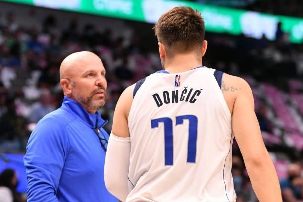 Head Coach Jason Kidd of the Dallas Mavericks and Luka Doncic talk during a preseason game against the Utah Jazz on October 6, 2021 at the American...