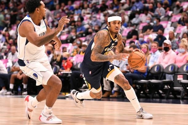 Jordan Clarkson of the Utah Jazz drives to the basket during a preseason game against the Dallas Mavericks on October 6, 2021 at the American...