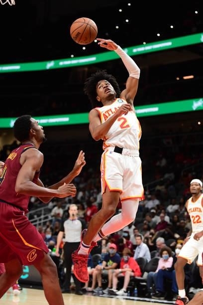 Sharife Cooper of the Atlanta Hawks passes the ball during a preseason game against the Cleveland Cavaliers on October 6, 2021 at State Farm Arena in...