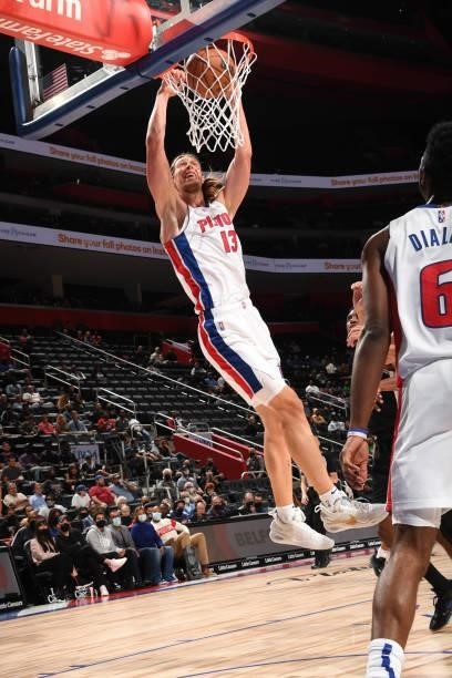 Kelly Olynyk of the Detroit Pistons dunks the ball during a preseason game against the San Antonio Spurs on October 6, 2021 at Little Caesars Arena...