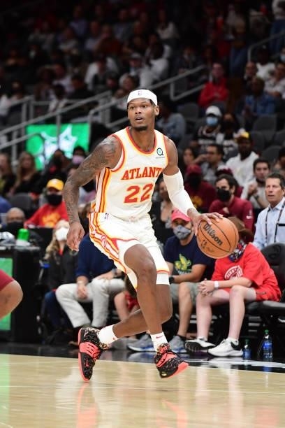 Cam Reddish of the Atlanta Hawks handles the ball during a preseason game against the Cleveland Cavaliers on October 6, 2021 at State Farm Arena in...