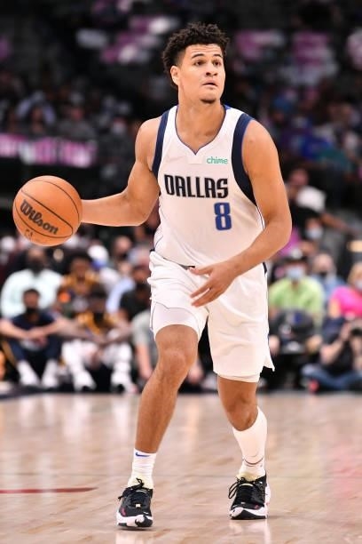 Josh Green of the Dallas Mavericks dribbles the ball during a preseason game against the Utah Jazz on October 6, 2021 at the American Airlines Center...