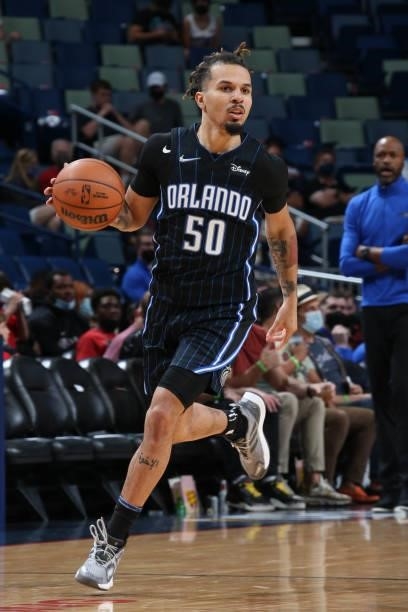 Cole Anthony of the Orlando Magic dribbles the ball during a preseason game against the New Orleans Pelicans on October 6, 2021 at the Smoothie King...