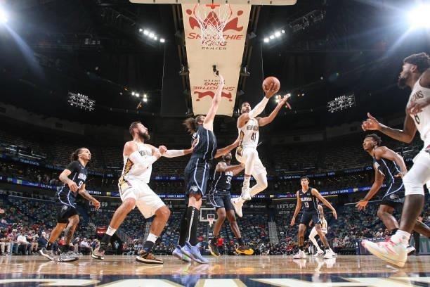 Garrett Temple of the New Orleans Pelicans drives to the basket during a preseason game against the Orlando Magic on October 6, 2021 at the Smoothie...