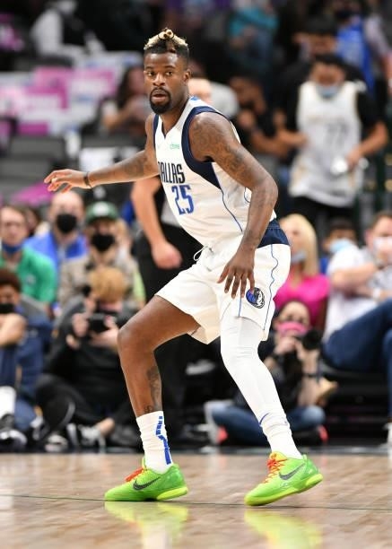 Reggie Bullock of the Dallas Mavericks plays defense during a preseason game against the Utah Jazz on October 6, 2021 at the American Airlines Center...
