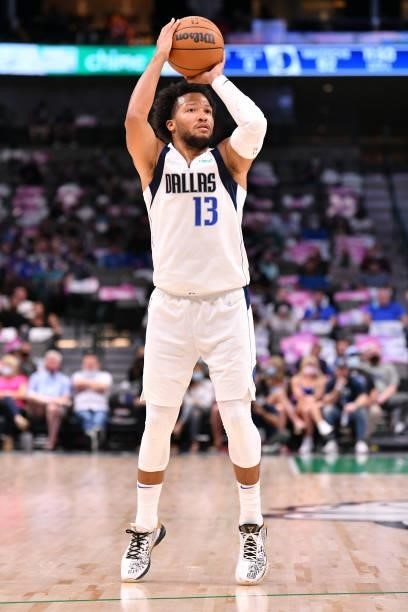 Jalen Brunson of the Dallas Mavericks shoots a three point basket during a preseason game against the Utah Jazz on October 6, 2021 at the American...
