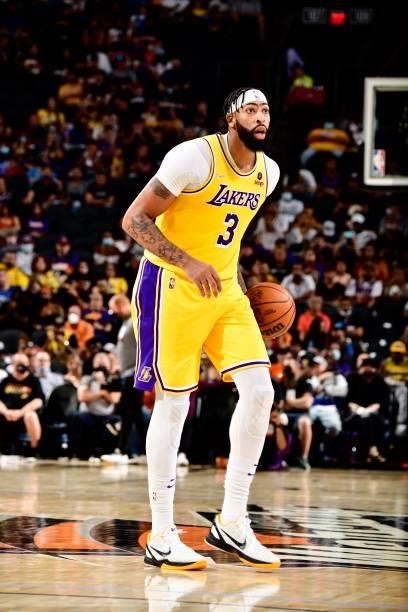 Anthony Davis of the Los Angeles Lakers handles the ball against the Phoenix Suns during a preseason game on October 6, 2021 at Footprint Center in...