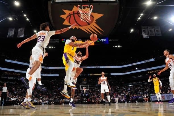 Anthony Davis of the Los Angeles Lakers drives to the basket against the Phoenix Suns during a preseason game on October 6, 2021 at Footprint Center...