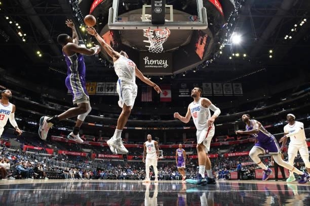 Nicolas Batum of the LA Clippers blocks the ball against the Sacramento Kings during a preseason game on October 6, 2021 at STAPLES Center in Los...