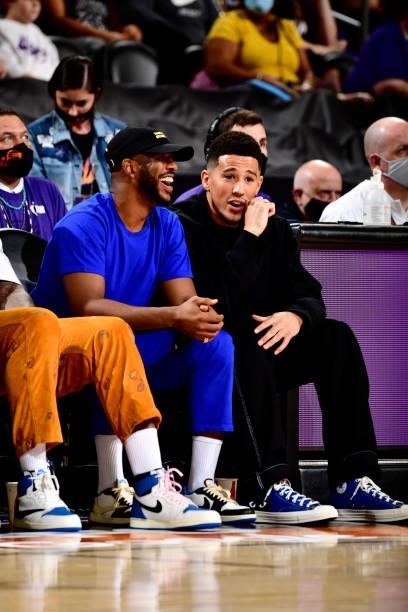 Chris Paul and Devin Booker of the Phoenix Suns attend Game Four of the 2021 WNBA Semifinals on October 6, 2021 at Footprint Center in Phoenix,...
