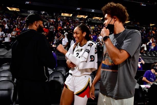 Mikal Bridges of the Phoenix Suns and A'ja Wilson of the Las Vegas Aces embrace after Game Four of the 2021 WNBA Semifinals on October 6, 2021 at...