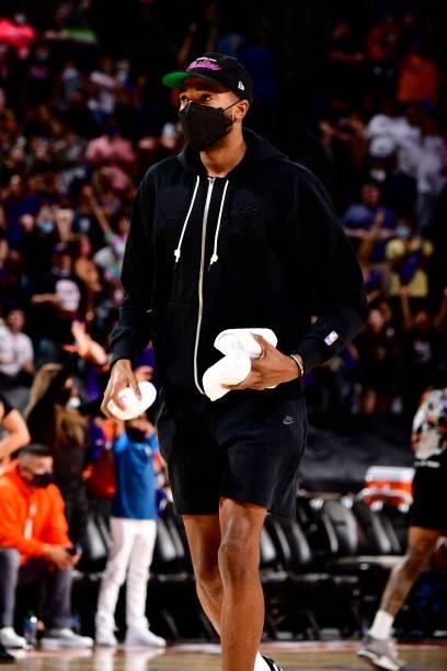 Mikal Bridges of the Phoenix Suns throws shirts to the fans during Game Four of the 2021 WNBA Semifinals on October 6, 2021 at Footprint Center in...