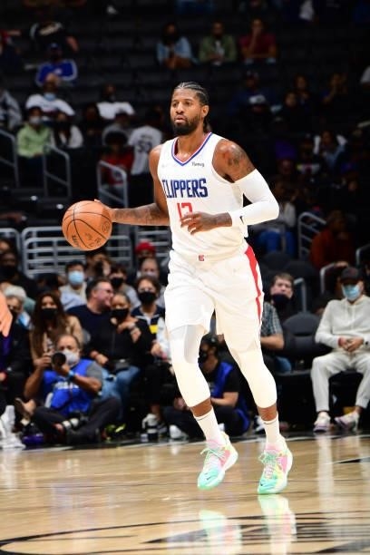 Paul George of the LA Clippers handles the ball against the Sacramento Kings during a preseason game on October 6, 2021 at STAPLES Center in Los...