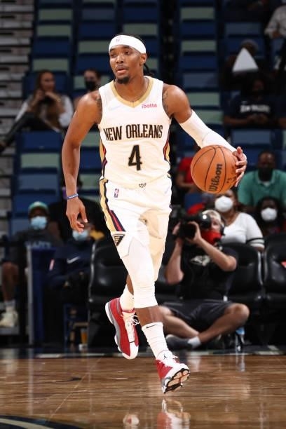 Devonte' Graham of the New Orleans Pelicans handles the ball against the Orlando Magic during a preseason game on October 6, 2021 at the Smoothie...