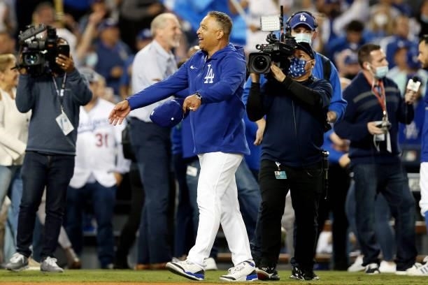 Manager Dave Roberts of the Los Angeles Dodgers celebrates after the Dodgers defeat the St. Louis Cardinals 3-1 in the NL Wild Card game at Dodgers...