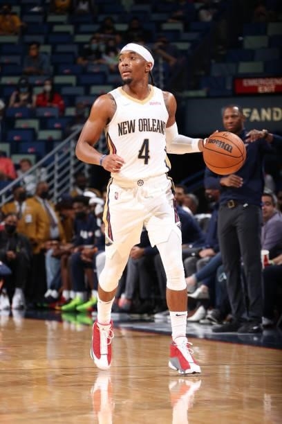 Devonte' Graham of the New Orleans Pelicans handles the ball against the Orlando Magic during a preseason game on October 6, 2021 at the Smoothie...