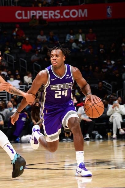 Buddy Hield of the Sacramento Kings handles the ball against the LA Clippers during a preseason game on October 6, 2021 at STAPLES Center in Los...