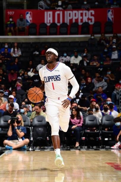 Reggie Jackson of the LA Clippers handles the ball against the Sacramento Kings during a preseason game on October 6, 2021 at STAPLES Center in Los...
