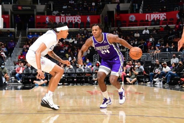 Buddy Hield of the Sacramento Kings handles the ball against the LA Clippers during a preseason game on October 6, 2021 at STAPLES Center in Los...