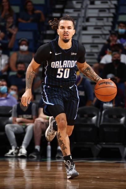 Cole Anthony of the Orlando Magic handles the ball against the New Orleans Pelicans during a preseason game on October 6, 2021 at the Smoothie King...