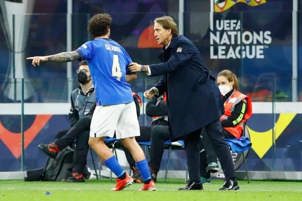 Davide Calabria of Italy and Head coach Roberto Mancini of Italy talk to each other during the UEFA Nations League Semi-Final match between the Italy...