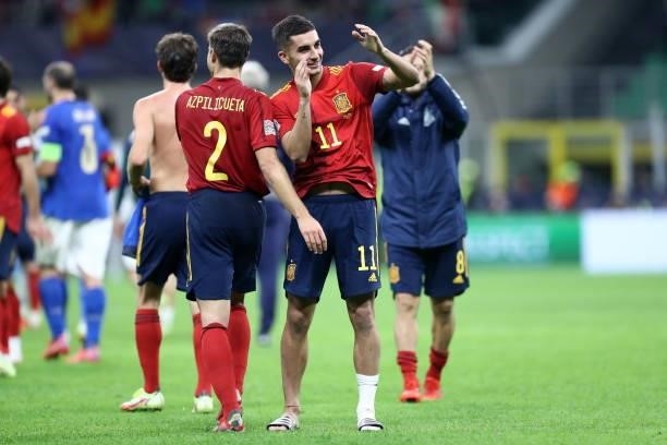 Ferran Torres of Spain and Cesar Azpilicueta of Spain celebrate after winning the UEFA Nations League Semi-Final match between the Italy and Spain at...