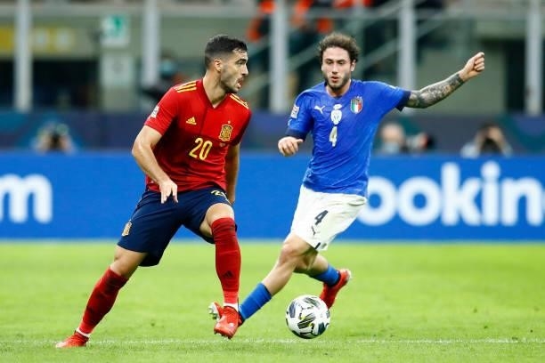 Mikel Merino of Spain and Davide Calabria of Italy battle for the ball during the UEFA Nations League Semi-Final match between the Italy and Spain at...
