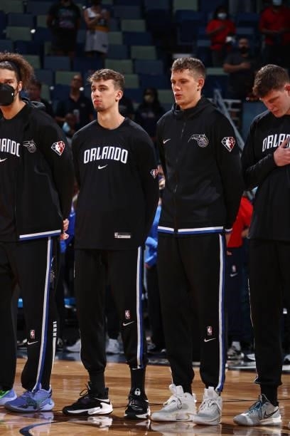 Franz Wagner and Moritz Wagner of the Orlando Magic stand for the National Anthem before the game against the New Orleans Pelicans during a preseason...