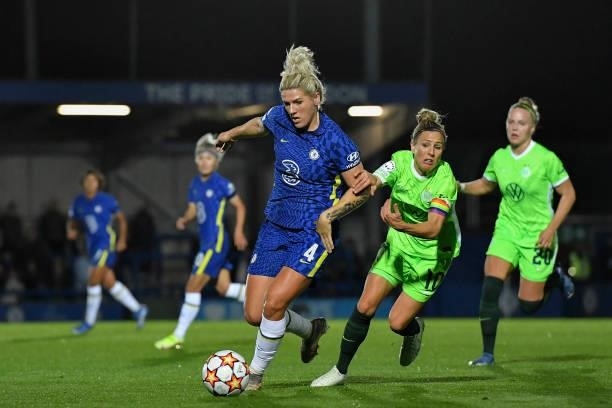 Millie Bright of Chelsea and Svenja Huth of VfL Wolfsburg battle for the ball during the UEFA Women's Champions League group A match between Chelsea...
