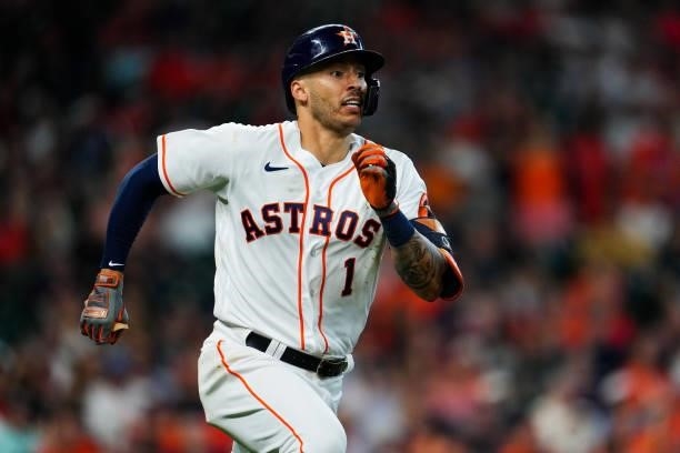 Carlos Correa of the Houston Astros runs to first after hitting a single in the seventh inning during Game 1 of the ALDS between the Chicago White...
