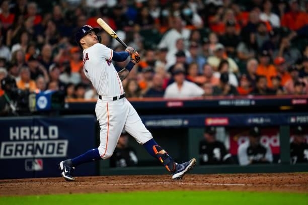 Carlos Correa of the Houston Astros hits a single in the seventh inning during Game 1 of the ALDS between the Chicago White Sox and the Houston...