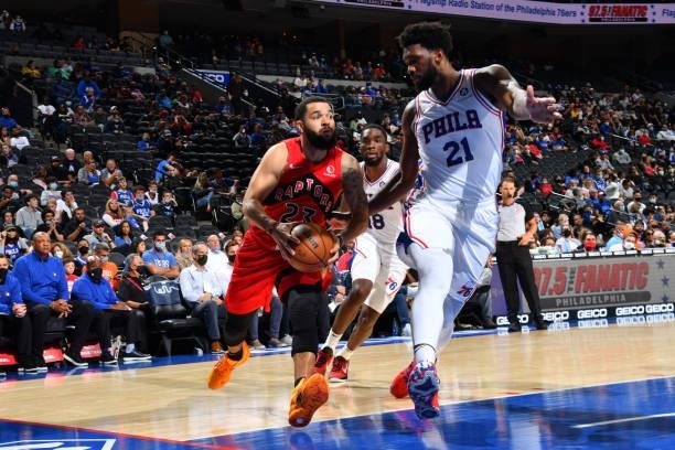 Fred VanVleet of the Toronto Raptors drives to the basket against Joel Embiid of the Philadelphia 76ers during a preseason game on October 7, 2021 at...
