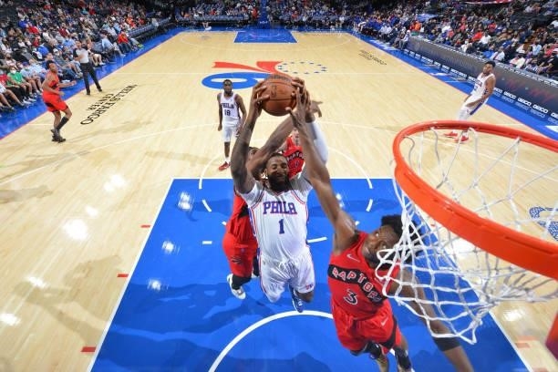Andre Drummond of the Philadelphia 76ers grabs the rebound during a preseason game on October 7, 2021 at Wells Fargo Center in Philadelphia,...