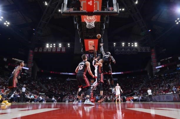 Dewayne Dedmon of the Miami Heat rebounds the ball during a preseason game against the Houston Rockets on October 7, 2021 at the Toyota Center in...