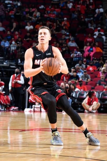 Duncan Robinson of the Miami Heat handles the ball during a preseason game against the Houston Rockets on October 7, 2021 at the Toyota Center in...