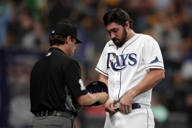 Feyereisen of the Tampa Bay Rays is checked by the umpire in the eighth inning during Game 1 of the ALDS between the Boston Red Sox and the Tampa Bay...