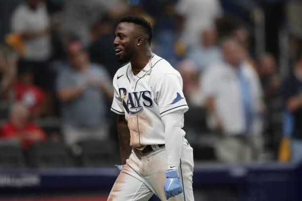 Randy Arozarena of the Tampa Bay Rays celebrates after stealing home in the bottom of the seventh inning during Game 1 of the ALDS between the Boston...