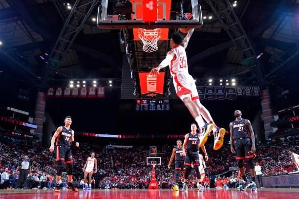 Christian Wood of the Houston Rockets dunks the ball during a preseason game against the Miami Heat on October 7, 2021 at the Toyota Center in...