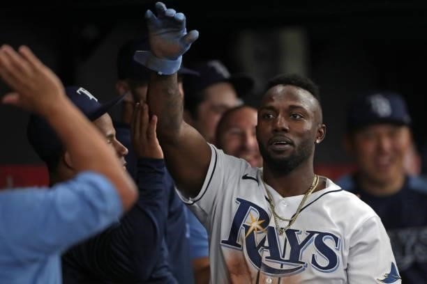 Randy Arozarena of the Tampa Bay Rays celebrates in the dugout after stealing home in the bottom of the seventh inning during Game 1 of the ALDS...