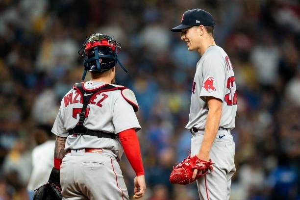 Nick Pivetta reacts with Christian Vazquez of the Boston Red Sox as he exits the game during the seventh inning of game one of the 2021 American...
