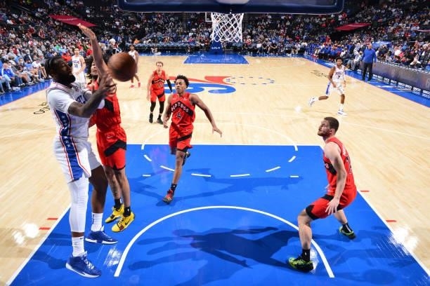 Andre Drummond of the Philadelphia 76ers passes the ball against the Toronto Raptors during a preseason game on October 7, 2021 at Wells Fargo Center...