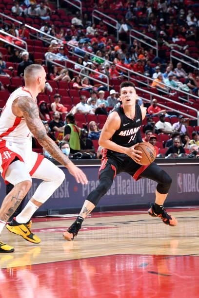 Tyler Herro of the Miami Heat handles the ball during a preseason game against the Houston Rockets on October 7, 2021 at the Toyota Center in...