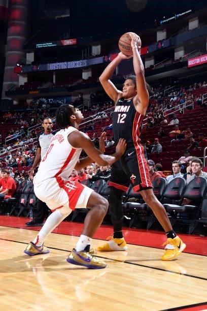 Dru Smith of the Miami Heat handles the ball during a preseason game against the Houston Rockets on October 7, 2021 at the Toyota Center in Houston,...