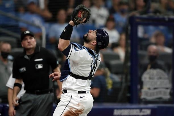 Mike Zunino of the Tampa Bay Rays catches a pop fly in the top of the ninth inning during Game 1 of the ALDS between the Boston Red Sox and the Tampa...