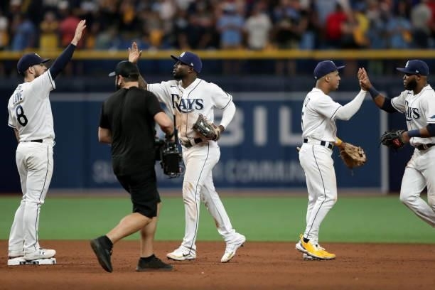 Members of the Tampa Bay Rays celebrate after defeating the Boston Red Sox 5-0 in Game 1 of the ALDS at Tropicana Field on Thursday, October 7, 2021...