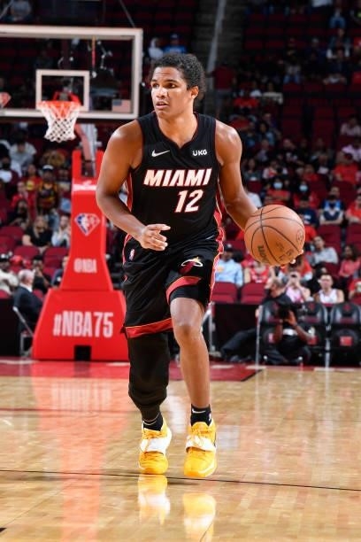 Dru Smith of the Miami Heat dribbles the ball during a preseason game against the Houston Rockets on October 7, 2021 at the Toyota Center in Houston,...