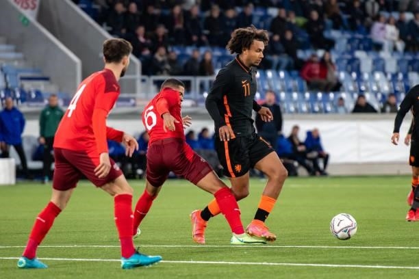 Joshua Zirkzee of Netherlands battles for the ball with Simon Sohm of Switzerland in front of Leonidas Stergiou of Switzerland during the 2021 UEFA...