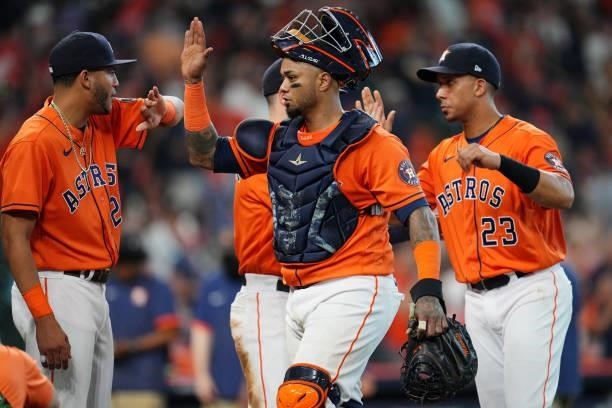 Martín Maldonado of the Houston Astros celebrates with teammates after the Astros defeated the Chicago White Sox in Game 2 of the ALDS at Minute Maid...